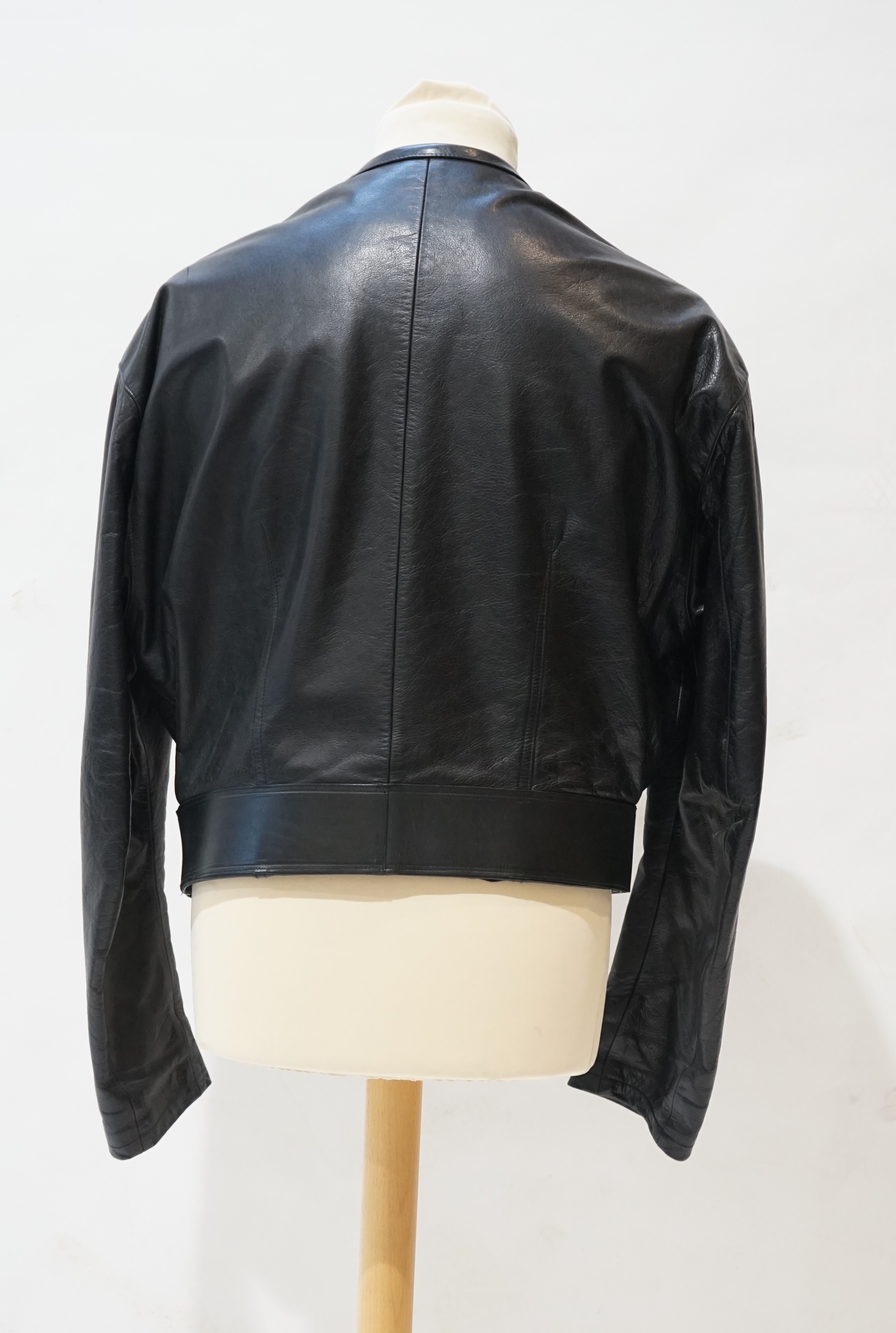 A gentleman's Calugi e Giannelli black leather jacket with metal appliques to the sleeves, size 52 (UK 48)